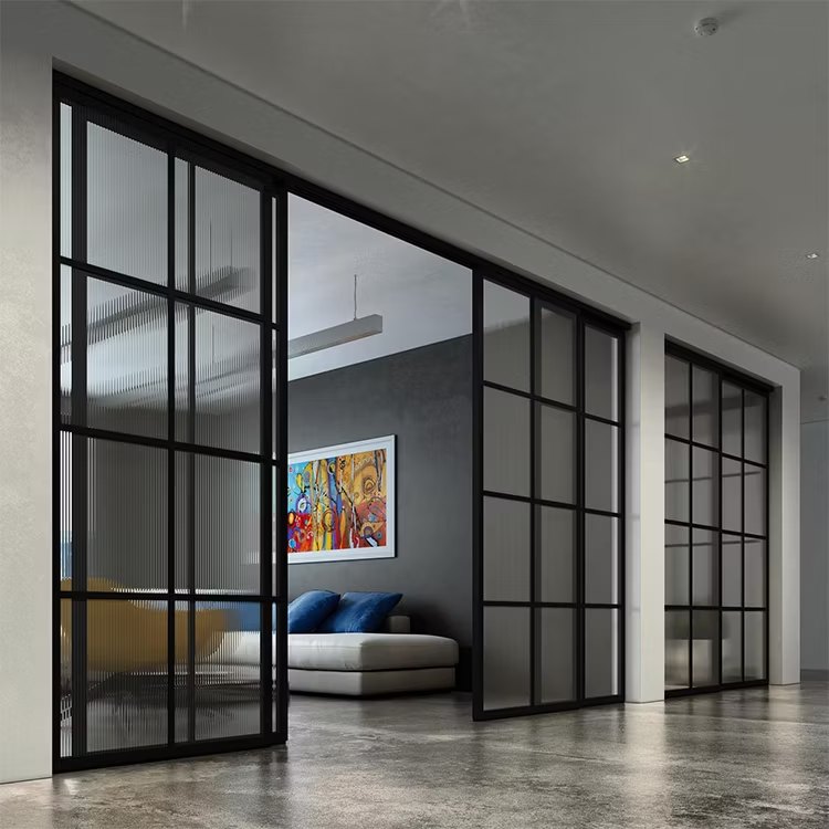 Automatic glass sliding doors installed at a commercial entrance in Abu Dhabi