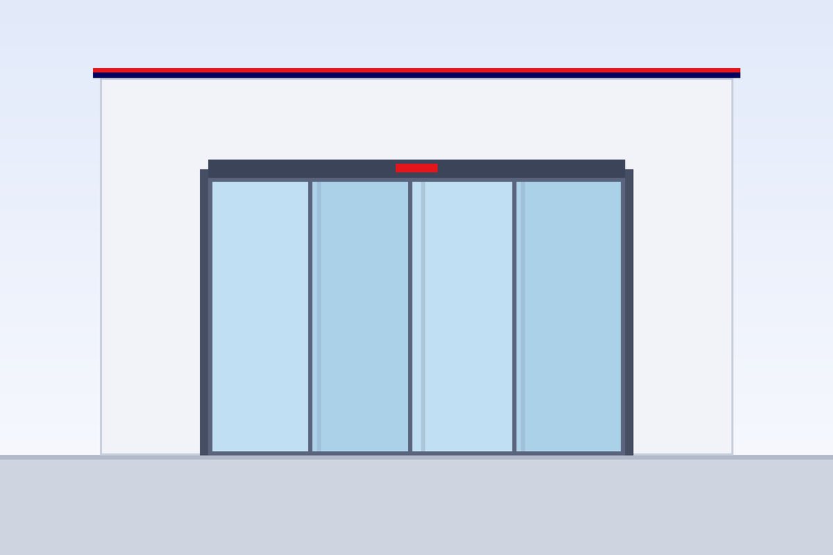 Automatic sliding glass doors at a shop entrance, open for a visitor