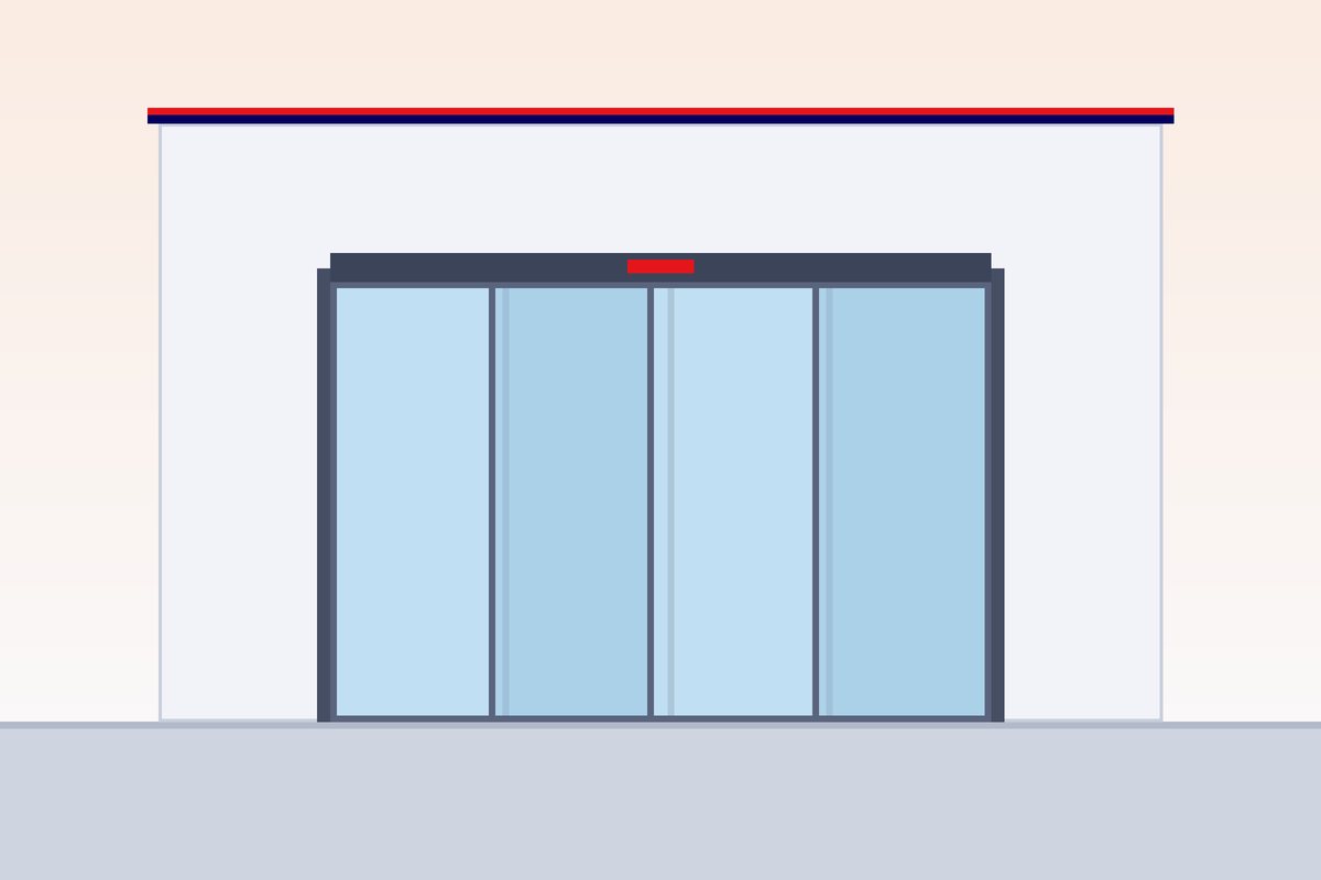 Overhead operator and track above an automatic sliding door