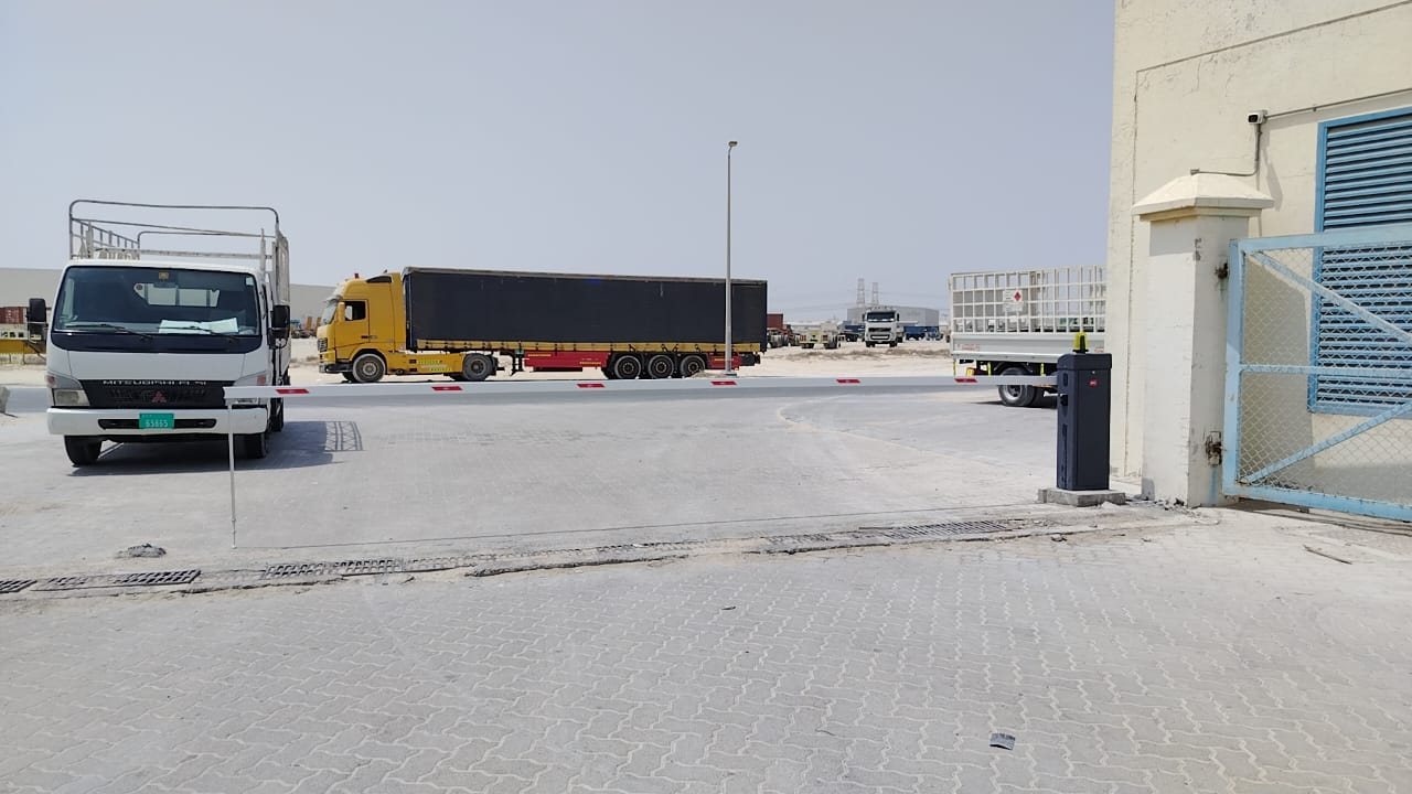 Vehicle entrance with a BFT automatic gate barrier for trucks in Jebel Ali Free Zone, Dubai